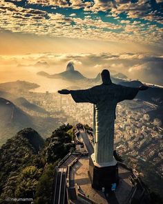 the statue of christ stands on top of a mountain