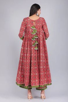 Red anarkali with patola print and pleated detail. Paired with printed palazzo and sheer dupatta.
Component: 3
Pattern: Printed
Type Of Work: Patola
Neckline: Round
Sleeve Type: Three Quarter
Fabric: Anarkali and Pant: Cotton, Dupatta: Soft Net
Color: Red
Other Details: 
Sheer dupatta
Back tassel tie-up
Occasion: Puja - Aza Fashions Anarkali Style Red Cotton Palazzo Set, Red Cotton Sharara For Designer Occasions, Red Bollywood Anarkali Set With Kalamkari Print, Festive Red Cotton Anarkali Set, Multicolor Cotton Anarkali Palazzo Set, Red Cotton Designer Dresses, Red Wedding Anarkali Set With Kalamkari Print, Red Cotton Salwar Kameez With Gota Work, Red Kalamkari Print Anarkali Set With Straight Kurta