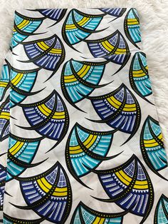 This African Fabric is high quality African print made from 100% cotton and it's 45 inches wide. It is used for making African Clothing, African quilts, & For Home decoration. FYI: Print is Double sided. The listing is for 1, 6 yards and Headwrap Each piece of fabric measures:  36in by 45in for 1 yard 216in by 45in for 6 yards 70in by 22in for Head wrap If you purchase more than one yard, you will receive one continuous piece. *If you require more than what I have listed, feel free to send me email. CARE INSTRUCTIONS: *DO NOT BLEACH *Hand wash with cold water and mild soap or Dry clean *Press with hot iron for a crispy look. Color may be different due to your monitor Printed Multicolor Ankara Fabric, Cotton Fabric With Graphic Print, Multicolor Printed Ankara Fabric, Ankara Fabric With Unique Pattern Prints, Multicolor Ankara Fabric With Abstract Pattern, Patterned Cotton Fabric With Graphic Print, Multicolor Print Fabric, Multicolor Cotton Fabric With Abstract Pattern, Printed White Ankara Fabric