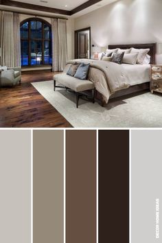 a bedroom with wood floors, white walls and brown furniture in shades of grays and browns