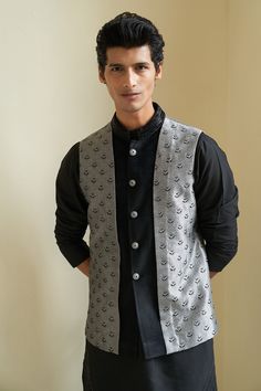 Black kurta with embroidered collar. Paired with herringbone textured bundi and pant.
Component: 3
Pattern: Embroidered
Type Of Work: Geometric
Neckline: Bundi: Open
Sleeve Type: Kurta: Long
Fabric: Suede, Jacquard
Color: Black
Other Details: 
Weight (in gm): 800
Herringbone texture
Occasion: Wedding - Aza Fashions Luxury Semi-formal Nehru Jacket With Stand Collar, Luxury Fitted Nehru Jacket For Winter, Luxury Fitted Nehru Jacket With Stand Collar, Luxury Black Nehru Jacket With Stand Collar, Luxury Fitted Classic Nehru Jacket, Luxury Black Nehru Jacket For Eid, Luxury Fall Nehru Jacket For Semi-formal Occasions, Luxury Classic Nehru Jacket, Luxury Nehru Jacket For Semi-formal Fall Occasions