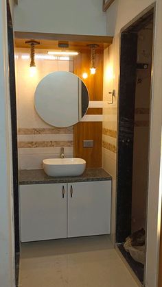 a bathroom with a sink and mirror in it