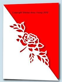 a red and white greeting card with a rose on the corner, which is cut out from