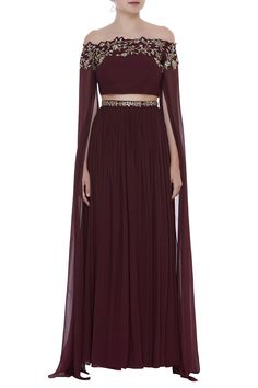 This deep and rich wine colored lehenga set has you covered for any occasion that may arise. Featuring dramatic cape sleeves with an embellished off shoulder neckline, the ensemble is accentuated with a matching skirt with an embellished waist. 
Cape sleeves
Embellished waist
Off shoulder neckline - Aza Fashions Waist Cape, Pleated Lehenga, Lehenga For Women, Embroidered Beads, Lehenga Online, Cape Sleeves, Buy Wine, Wine Colored, Aza Fashion