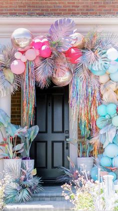 an entrance decorated with balloons and streamers