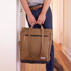 Meet the new Tote Pack in taupe. Carry as a tote with the strong leather handles or use the convertible straps for over your shoulder look or as a backpack. Made from strong weather-resistant polyester and the finest eco-friendly, vegetable tanned, biodegradable leather.  Size: 13" x 5" x 16" Weather resistance-polyest Beige Bags With Reinforced Handles, Beige Shoulder Bag With Reinforced Handles For Everyday, Brown Everyday Bags With Reinforced Handles, Beige Everyday Bags With Reinforced Handles, Everyday Beige Bags With Reinforced Handles, Casual Brown Bag With Reinforced Handles, Everyday Double Handle Shoulder Bag With Reinforced Handles, Brown Tote Bag With Reinforced Handles, Brown Bag With Double Reinforced Handles