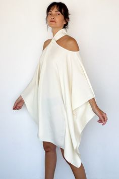 Mambo Piccolo Caftan in Ivory from Taller Marmo Caftan style mini dress Cut outs on the shoulders with long billowing sleeves Covered buttons behind neck Draping fluid crepe fabric 78% acetate, 22% viscose One size Made in Italy Model Measurements & Item Sizing: Model Height: 5'8” Model size: US 2 / S / 26 Size shown on model: one size Long Cream Dress, Taller Marmo, White Fits, Open Shoulder Dress, Drape Dress, Caftan Dress, Dressed To Kill, Draped Dress, Cream Dress