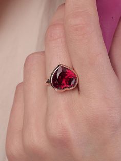 With its playful, symbolic vibe and juicy red color, this striking ring from our Simplicity Collection is a perfect addition to any modern collection. Large red heart shaped ruby is encased in meticulously hand finished band. This stunning ring will make a fun alternative to a traditional cocktail ring. Ruby 11mm x 12mm Follow us on Instagram: https://www.instagram.com/missionewyork/ Rose Gold Ruby Ring For Valentine's Day Gift, Elegant Heart Shaped Rings For Parties, Elegant Heart-shaped Rings For Party, Fine Jewelry Ruby Ring For Valentine's Day, Valentine's Day Fine Jewelry Ruby Ring, Red Heart Cut Ruby Ring In Fine Jewelry Style, Fine Jewelry Red Heart Cut Ruby Ring, Red Heart Cut Ruby Ring Fine Jewelry, Red Heart Cut Ruby Ring For Proposal