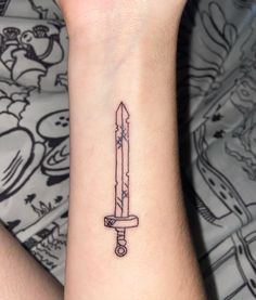 a tattoo on the wrist of a person with a knife in it's hand