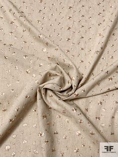 the fabric is very soft and has small flowers on it, as well as stars