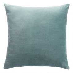 a light blue pillow on a white background