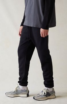 Sit back and relax in PacSun's new Black Sweatpants. These comfortable sweatpants are complete with a soft fleece lining, side hand pockets, a drawstring waistband, and elastic ankle cuffs.


	30" inseam
	Soft fleece lining
	Side hand pockets
	Drawstring waistband
	Elastic ankle cuffs
	Single back pocket
	PacSun woven label
	Stretchy
	60% cotton, 40% polyester
	Machine washable
	Model is wearing a size medium
	Model Measurements: 6'2” Height, 30" Waist, 37.5” Hips, 36.5&rdq Solid Sweats With Drawstring For Streetwear, Solid Color Sweats With Drawstring For Streetwear, Sporty Loose Fit Sweatpants With Drawstring, Solid Color Streetwear Sweats With Drawstring, Baggy Drawstring Sporty Sweatpants, Sporty Baggy Sweatpants With Drawstring, Sporty Baggy Drawstring Sweatpants, Streetwear Fleece Sweatpants With Elastic Waistband, Joggers With Drawstring Straight Leg