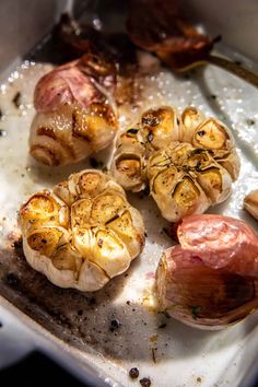 garlic and onions are being cooked on the stove