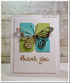 a card with a butterfly on it and the words thank you written in gold ink