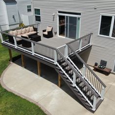 a deck with stairs leading up to the patio