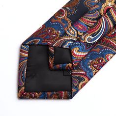 The tie is part of our best-selling line of neckties. Feature with unique shape design, this tie could make you out of ordinary. Dry clean only Standard Tie Adopting the soft and good texture, this paisley floral tie is comfortable to wear and to touch, which is a must-have accessory for any successful man. Tie Width: 3.4 inches(8.5cm); Tie Length: 59 inches(150cm); Handkerchief size: 10 inches x 10 inches(25cm x 25cm) Material: 100% silk Crafts: jacquard woven tie Occasions for business/party/d Multicolor Pocket Square For Black Tie Events, Multicolor Suit And Tie Accessories With Pocket Square, Multicolor Tie With Pocket Square, Silk Crafts, Multicolor Ties With Pocket Square, Formal Patterned Ties With Paisley Print, Blue Paisley Print Business Ties, Successful Man, Luxury Classic Ties With Paisley Print