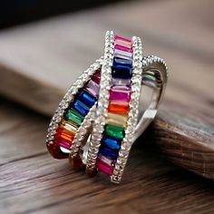 Beautiful In Meaning And Appearance, Rainbows Hold A Special Place In Many Hearts. Crafted In Sterling Silver, This Ring Boasts A Stunning X Crossover Design That Is Lined With Baguette-Shaped Cubic Zirconia Stones In A Rainbow Of Vibrant Colors. The Rainbow Rows Are Bordered On Each Side With Round, Clear Cubic Zirconia Stones For Added Sparkle And Shine. This Ring Measures 14mm Across The Top And 7mm Across The Bottom. Specifications Ring Width: 14 To 7 Mm Metal: 925 Sterling Silver Stone Type Rainbow Row, Macys Jewelry, Ring Pop, Baguette Ring, Rainbow Jewelry, Sparkle And Shine, Clear Stone, A Rainbow, The Rainbow