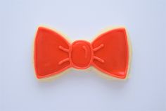 an orange bow cookie on a white background