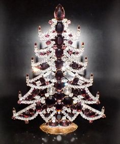 a christmas tree made out of various jewels