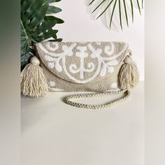 Floral Embellished Boho Chic Bag Condition: Brand New! Details: Handmade Item - Handwoven Color: Beige & White Dimensions: 10.5"W X 6.5" L Total Length: 25" These Fun & Funky Bag Was 100% Hand Knit By Wayuu Women But Designed By Us. The Wayuu Are An Indigenous Tribe In Colombia Known For Their Beautiful Handwoven Work, And This Bag Represents About A Week's Worth Of Work. Vacation White Clutch Shoulder Bag, Embroidered White Shoulder Bag For Vacation, White Clutch Shoulder Bag For Vacation, White Embroidered Shoulder Bag For Vacation, White Embroidered Beach Bag, Chic White Embroidered Bag, Bohemian White Crochet Pouch Bag, White Bohemian Crochet Pouch Bag, White Pouch Clutch For Beach