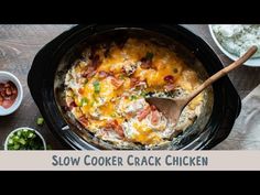 a crock pot filled with ham and cheese next to bowls of chopped green onions