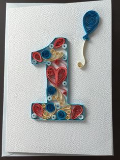 a card with the number one made out of paper