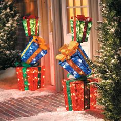 christmas presents are wrapped in colorful lights outside