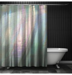 a bath tub sitting next to a shower curtain