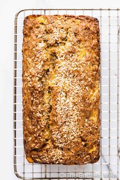 a loaf of bread sitting on top of a cooling rack