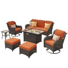 an outdoor patio furniture set with orange cushions and matching foot stools, including a coffee table