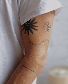 a person with a tattoo on their arm