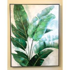 a painting with green leaves hanging on the wall