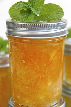 a mason jar filled with honey and mint