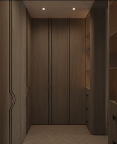 an empty room with wooden closets and shelves