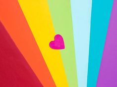 a rainbow colored background with a heart on it