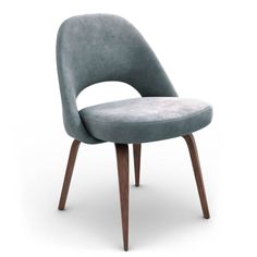 an upholstered chair with wooden legs and a grey velvet seat, viewed from the front