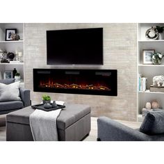 a living room with two couches and a large television mounted on the wall above it