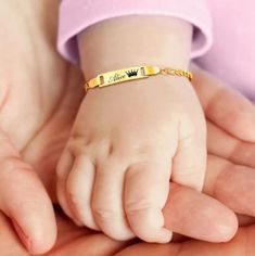 Discover the perfect keepsake with our Customized Name Bracelets for Infants, a thoughtful and enduring gift that celebrates those special early moments. Meticulously crafted from non-allergenic stainless steel, these baptism bangles are not only safe for sensitive skin but also exude a timeless elegance. Key Features: Metals Type: High-quality Stainless Steel, known for its durability and hypoallergenic properties. Length: Adjustable from 12 to 15 cm, ensuring a comfortable and secure fit as your child grows. Personalization: Customize with your child's name, making it a unique and cherished item. Ideal for Special Occasions: Perfect for baptisms, birthdays, or as a family love gift, this bracelet serves as a beautiful symbol of affection and memory. Jewelry Care Instructions: To maintain Gold Name Bracelet For Father's Day Gift, Personalized Bracelet For Birthday Gift, Gold Bracelet For Father's Day Gift, Personalized Birthday Bracelets As Gifts, Father's Day Gold Name Bracelet Gift, Father's Day Gift Gold Name Bracelet, Gold Name Bracelet For Anniversary On Father's Day, Customizable Adjustable Gold Bracelet For Gifts, Name Bracelets For Father's Day Birthday