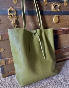 Soft Italian leather tote bag.  Made in Italy. Flexible, roomy every day bag. Green Tote Shoulder Bag For Work, Green Textured Leather Bags For Work, Green Leather Shoulder Bag For Work, Green Rectangular Bag With Smooth Grain, Green Faux Leather Travel Shoulder Bag, Everyday Green Leather Shoulder Bag, Travel Bags In Smooth Grain Faux Leather, Green Faux Leather Bag For Office, Green Faux Leather Office Bag