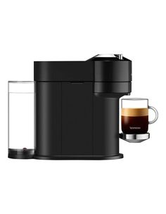 a black coffee maker with a glass next to it