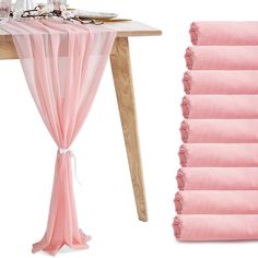 the table is covered with pink linens