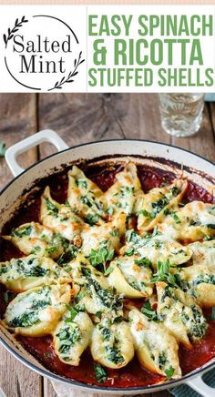 an easy spinach and ricotta stuffed shells recipe in a skillet on a wooden table