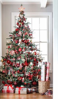 a christmas tree decorated with red and gold ornaments