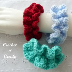 three crocheted scrunffles on top of a white mannequin