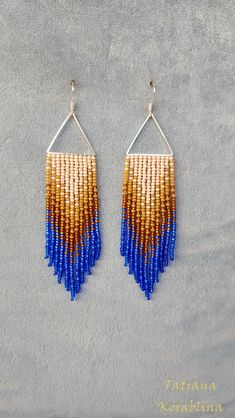 These handmade earrings are made of high-quality Czech beads and strong synthetic thread. They are elegant, fashionable, and highly versatile, suitable for everyday wear. Color: beige,blue,brown . 100% hand made with love! Measurements: Length-about 11cm (4.33 inch) Width -about 2.5 cm (1 inch) Materials: Sterling silver hook Czech glass beads Nylon Thread Bohemian Blue Triangle Earrings, Blue Bohemian Triangle Earrings, Chandelier Boho, Red Chandelier, Beige Earrings, Earrings Triangle, Abstract Floral Print, Triangle Earrings, Earrings Long