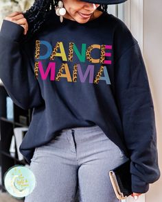 Dance Mama, Dance Shirts, Gifts for Mom, Leopard and Leotards, Toddler Dance, Dance Troop, Team Mom Tshirt, Leopard Print, Hip Hop Dance, Ballet Mom, Cheerleading Tees, Shirts for Mom, Mama Sweatshirt This soft sweatshirt has a loose fit for a comfortable feel. With durable print, it will be a walking billboard for years to come. -Loose fit -50% Cotton; 50% Polyester (fibre content may vary for different colors) -Unisex - Fits true to size (see size chart for reference) - If you prefer an oversi Stretch Black Top For Dance Class, Black Stretch Top For Dance Class, Black Tops With Letter Print For Dance Class, Black Relaxed Fit Top For Dance Class, Hip Hop Long Sleeve Sweatshirt For Dance, Casual Tops For Dance In Fall, Casual Tops For Fall Dance, Long Sleeve Graphic T-shirt For Dance, Long Sleeve Graphic Print T-shirt For Dance