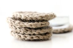 three coils of rope sitting next to each other on top of a white surface