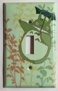 a light switch cover with an image of a cat holding an umbrella on it's head