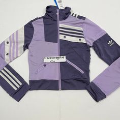 Adidas Danielle Cathari Track Jacket Color: Tech Purple Tagged Size: Women's 2XS (Check Measurements) Retail: $100 100% Authentic Guaranteed Actual Measurements: Pit to pit: 14" Length: 18" Shoulder to shoulder: 14" Sleeve: 24" Details: HIGHLIGHTS CLASSIC CUT The regular fit takes cues from retro track jackets. RETRO REDEFINED Amsterdam-based designer Daniëlle Cathari reimagines 3-Stripes style in her collection with adidas. SHINE ON Recycled polyester tricot brings an elegant, silky sheen to yo Trendy Long Sleeve Patchwork Track Jacket, Adidas Fitted Track Jacket For Streetwear, Adidas Fitted Casual Track Jacket, Fitted Casual Adidas Track Jacket, Fitted Track Jacket With Pockets, Spring Adidas Fitted Track Jacket, Adidas Fitted Track Jacket For Spring, Trendy Fitted Track Jacket For Fall, Fitted Purple Outerwear For Streetwear