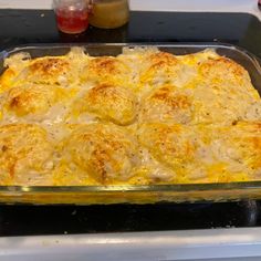 a casserole dish with cheese and meat in it on a stove top, ready to be eaten